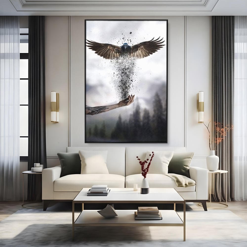 Tablou canvas cu tablou canvas cu pasare si mana din cenusa, in rama de aluminiu negru, pe perete intr-un living